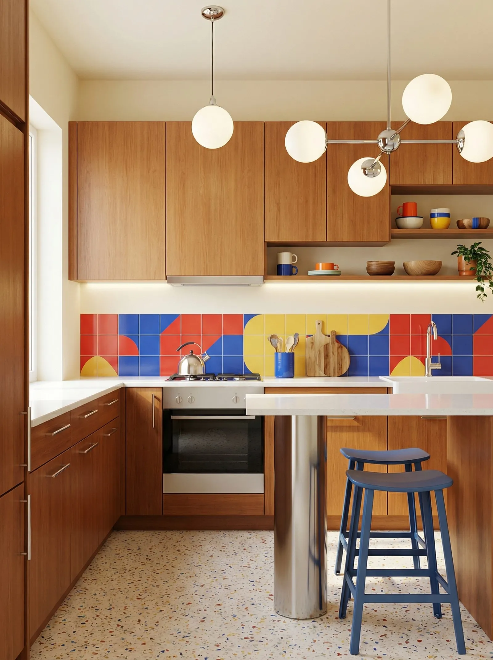 Walnut slab cabinet doors with slim bar pulls, a red, blue and yellow tile splashback made of squares and quarter-circles, white quartz worktop, terrazzo floor, a chrome sputnik light beside a globe pendant, two blue stools at a breakfast bar.